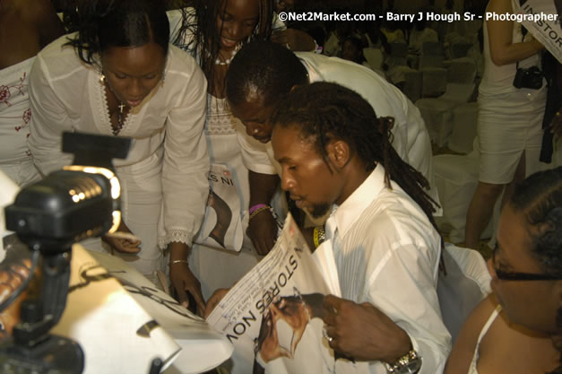 Jah Cure Signs Guest Poster - Reflections - Cure Fest 2007 - All White Birth-Night Party - Hosted by Jah Cure - Starfish Trelawny Hotel - Trelawny, Jamaica - Friday, October 12, 2007 - Cure Fest 2007 October 12th-14th, 2007 Presented by Danger Promotions, Iyah Cure Promotions, and Brass Gate Promotions - Alison Young, Publicist - Photographs by Net2Market.com - Barry J. Hough Sr, Photographer - Negril Travel Guide, Negril Jamaica WI - http://www.negriltravelguide.com - info@negriltravelguide.com...!